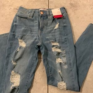 Light colored ripped jeans